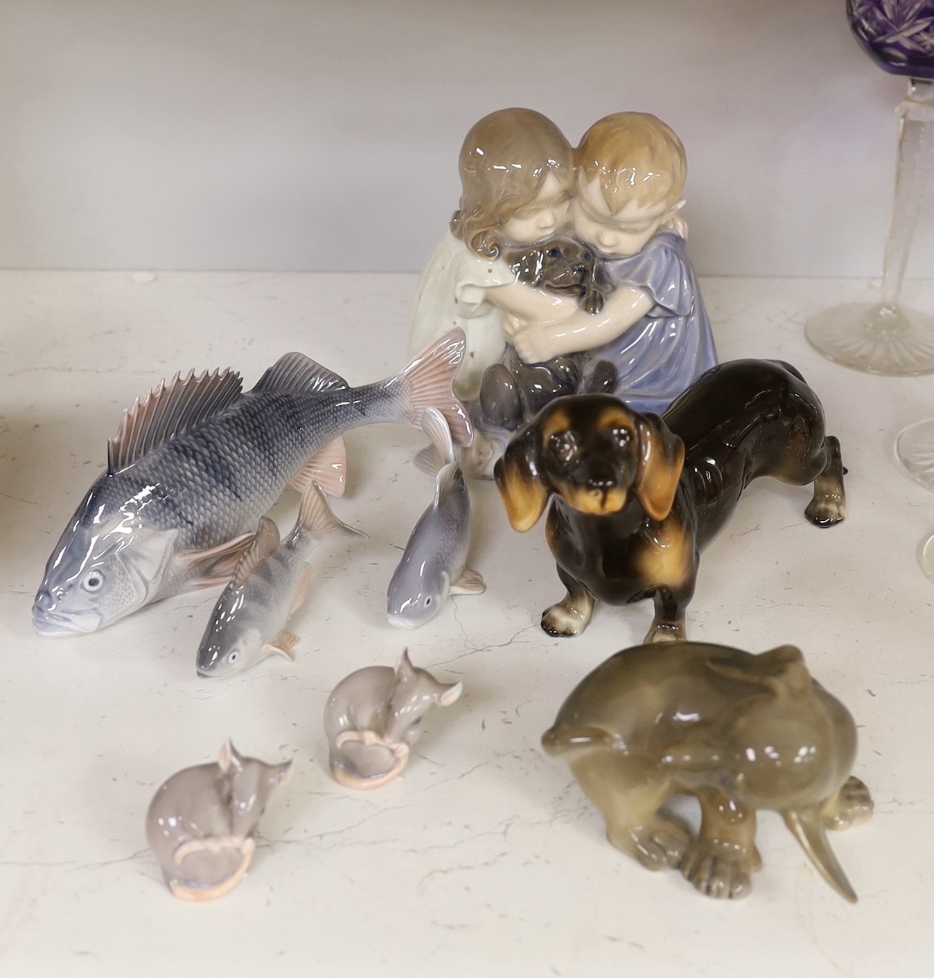 A Royal Copenhagen figure group of two children hugging a puppy, two other dog ornaments, three fish and a pair of mice (8). Tallest 16cm